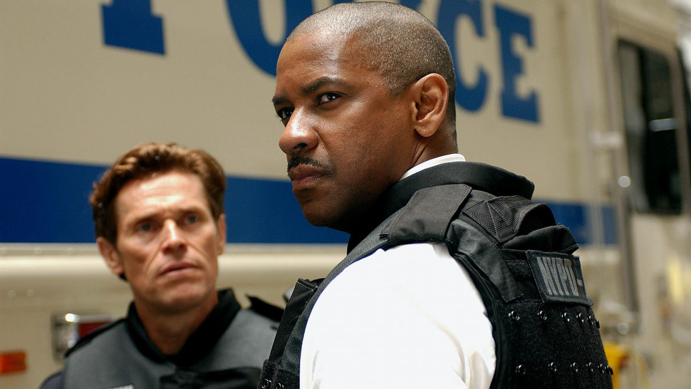 (L-R) Willem Dafoe and Denzel Washington wearing bulletproof vests in front of a police van in Inside Man.