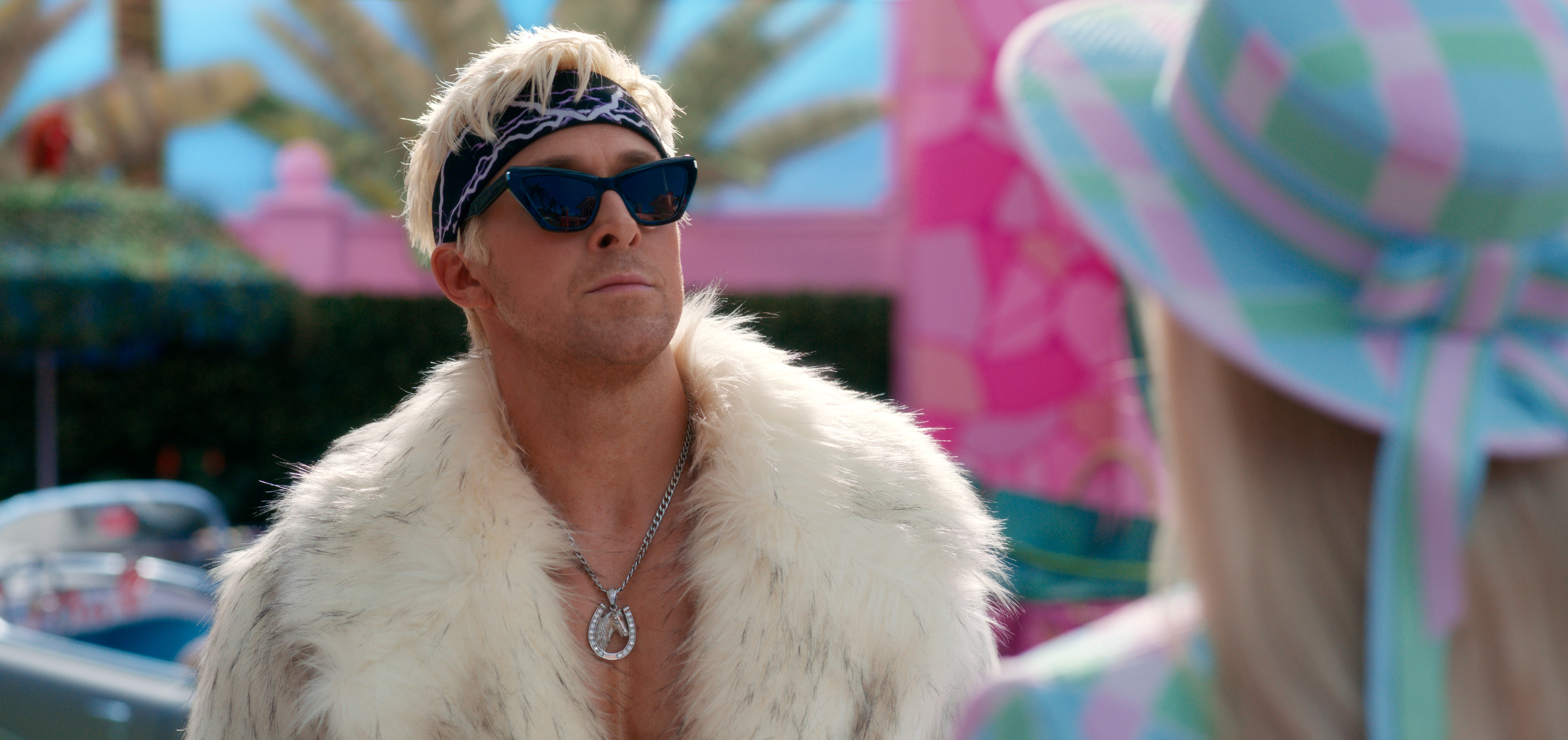 Ken (Ryan Gosling) in sunglasses and a fur coat, looking sassy