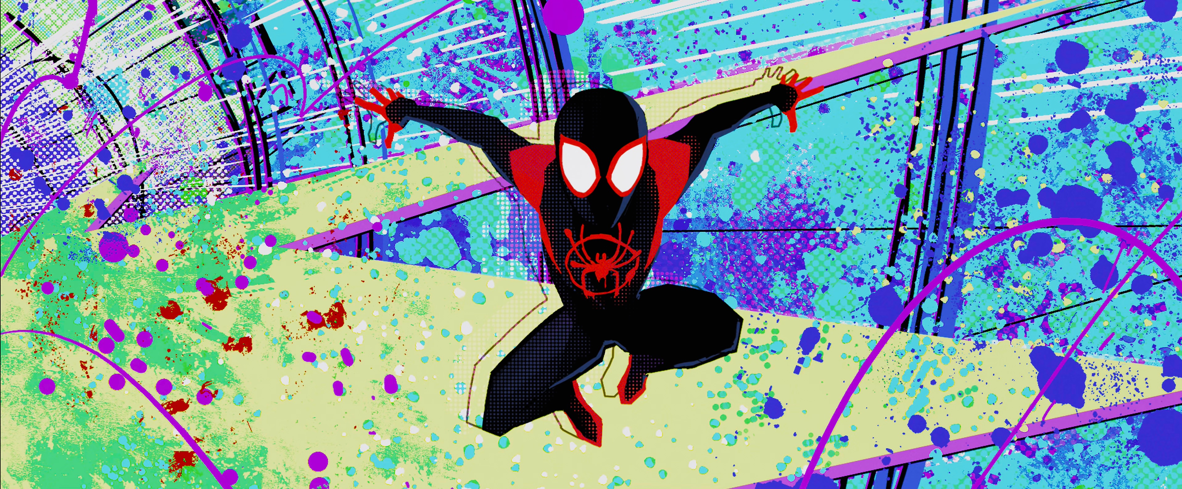 Miles Morales jumps around the dimension portal machine as it explodes in an array of colors and textures in Spider-Man: Into the Spider-Verse